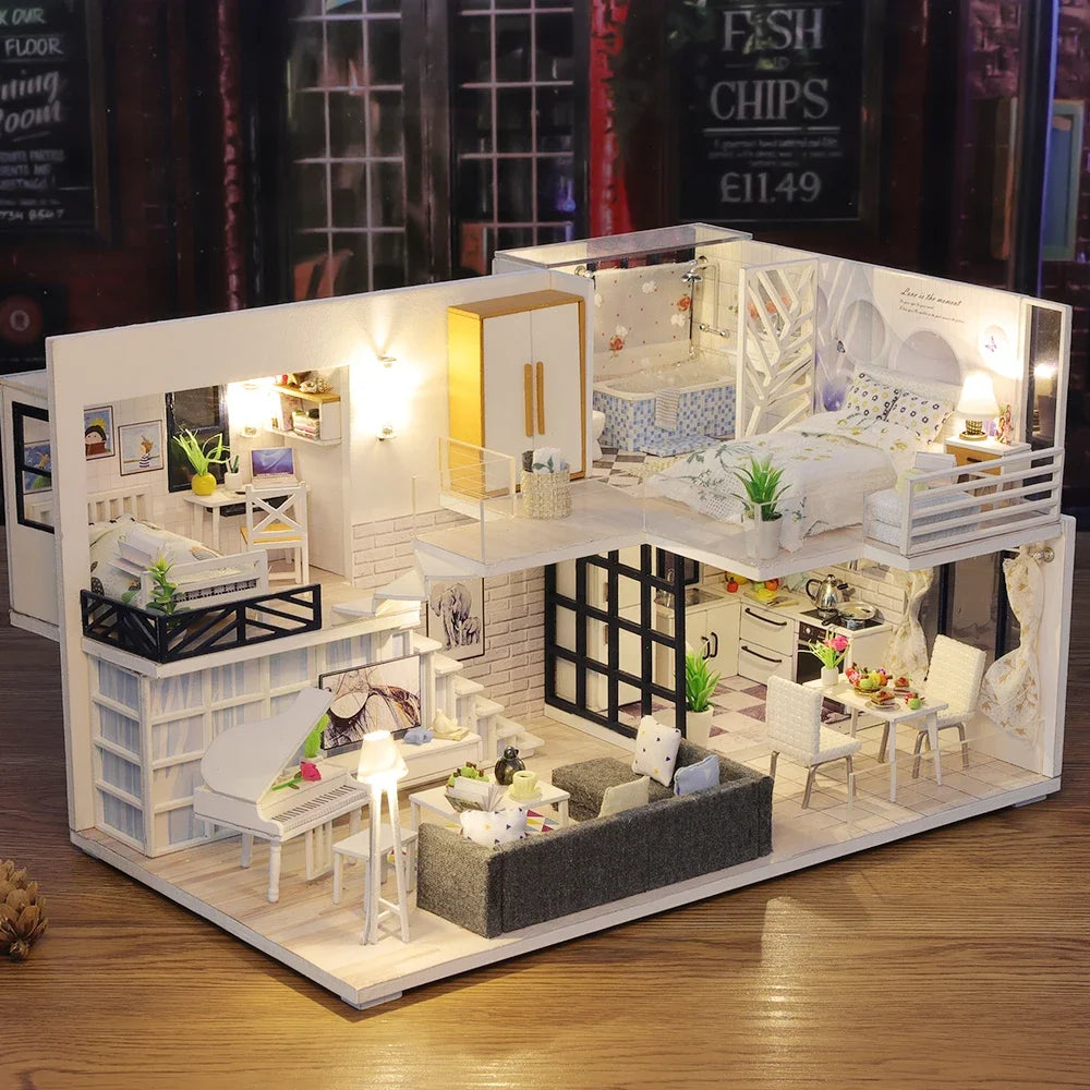 Model of a miniature house with rooms including a living room, kitchen, and bedroom.