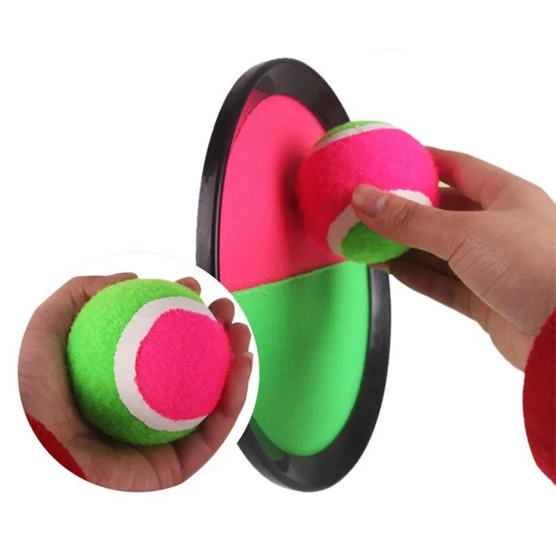 Green and pink foam dumbbells being held by a hand on a white background