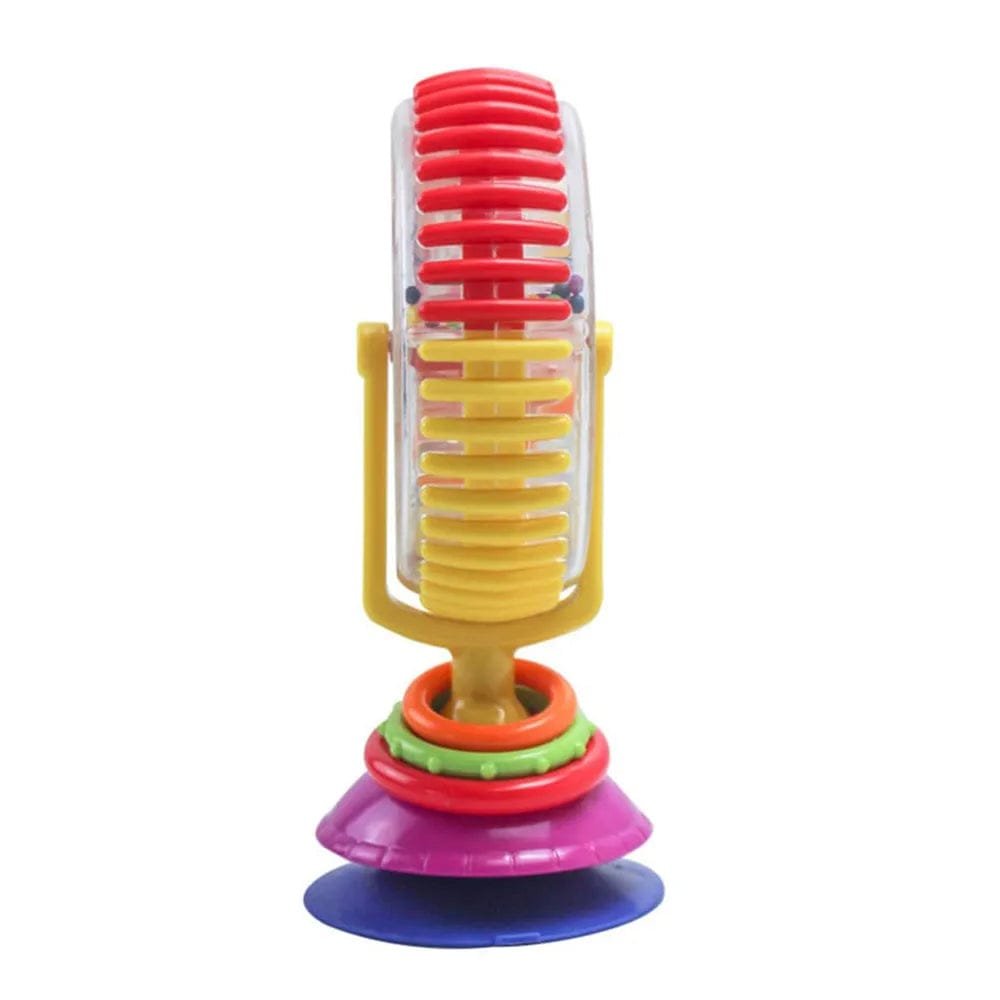 Colorful toy microphone with a transparent body and multicolored accents on a white background
