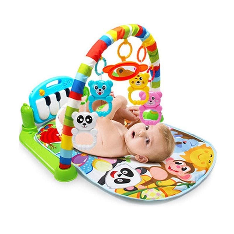 Baby playing with a colorful activity gym.