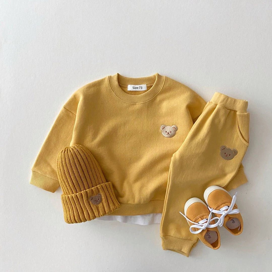 Yellow children's outfit with bear details