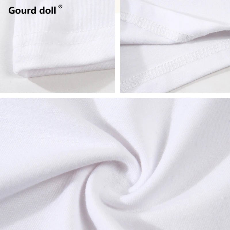 Close-up of white fabric with 'Gourd doll' branding.
