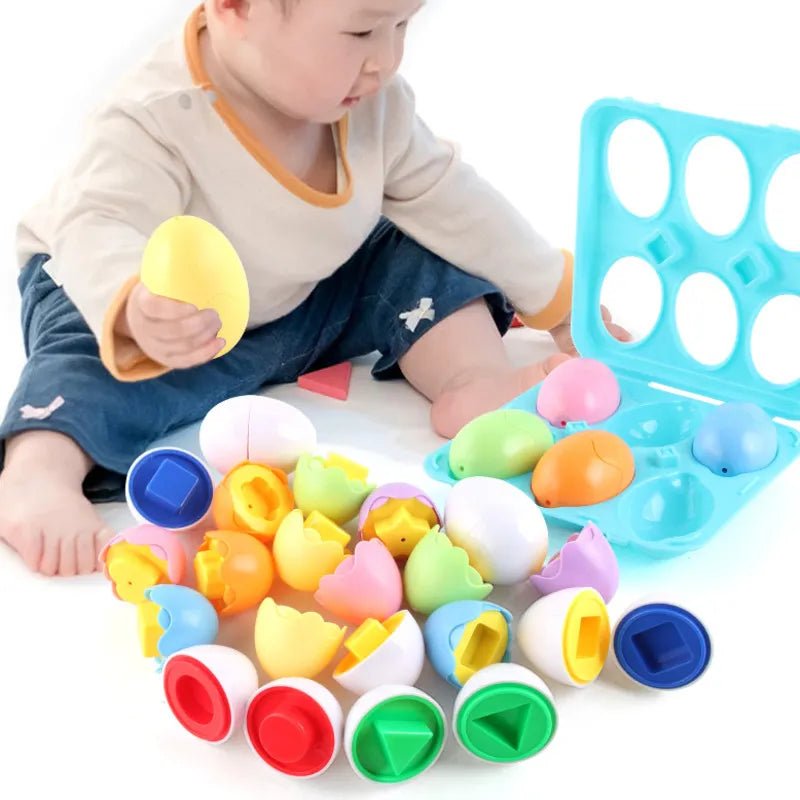 Child playing with colorful plastic eggs and a blue egg holder on a white surface.