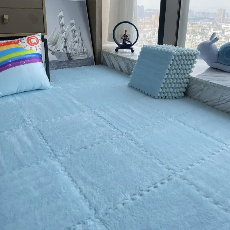Bed with light blue bedding, decorative pillows, and a cityscape view from a window.
