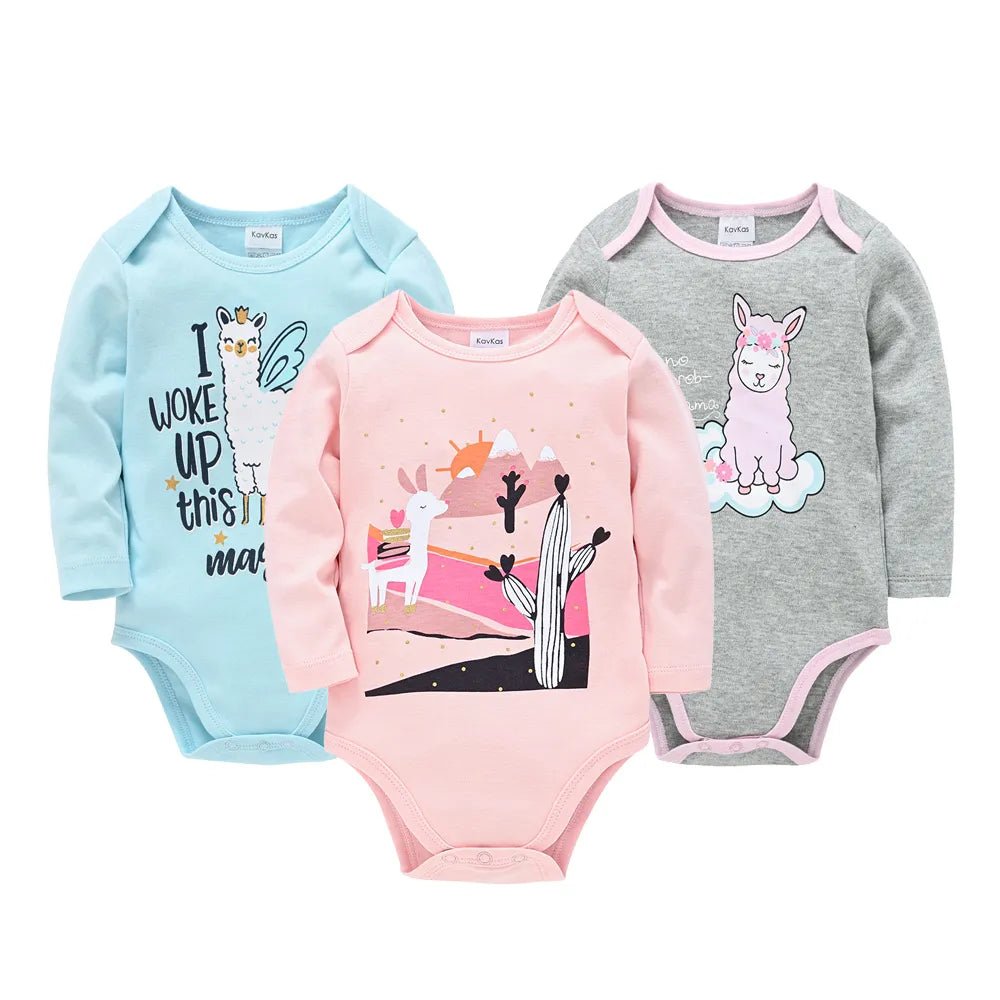Three baby bodysuits in blue, pink, and gray with various designs