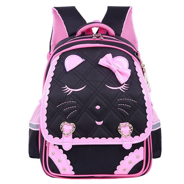 Black and pink backpack with cartoon face design.