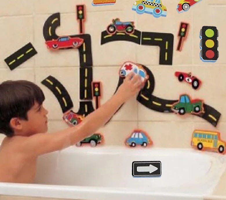 Child playing with bath toy set featuring roads, cars, and traffic lights in a bathtub.