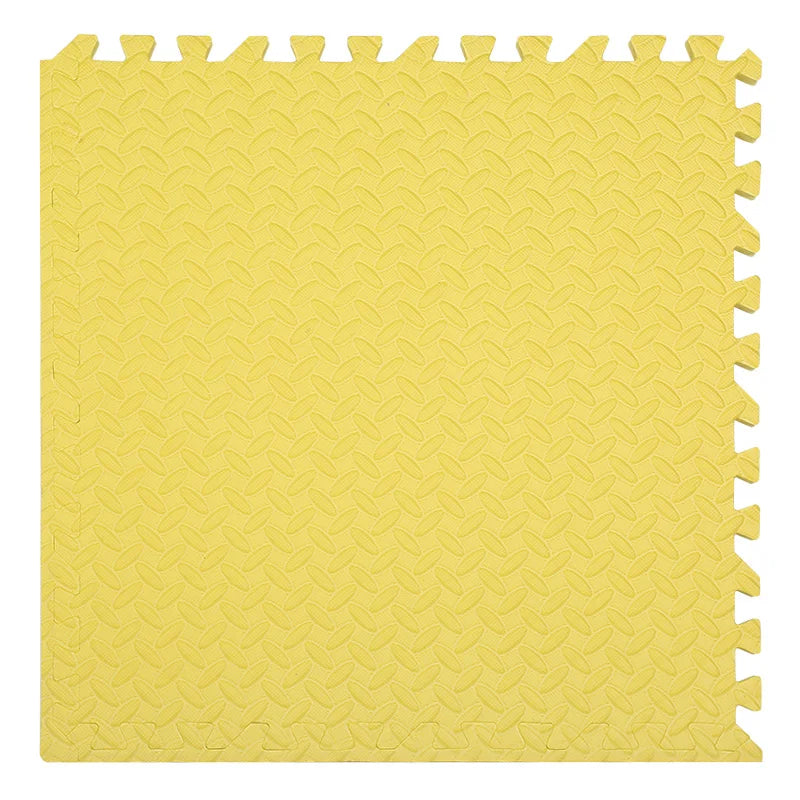 Yellow foam puzzle mat with interlocking edges.