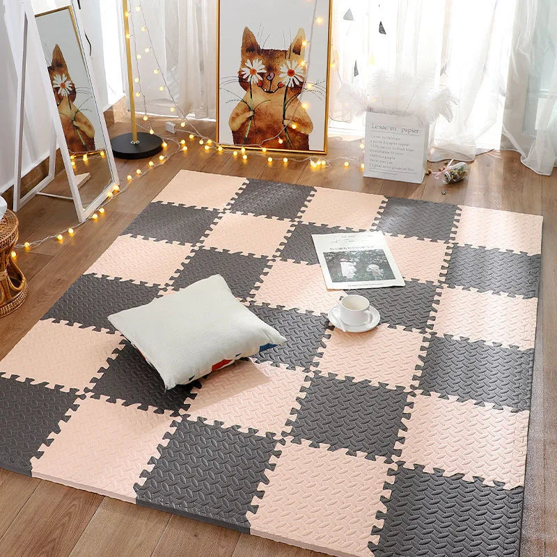 Checkered foam puzzle mat on a wooden floor with decorative elements.