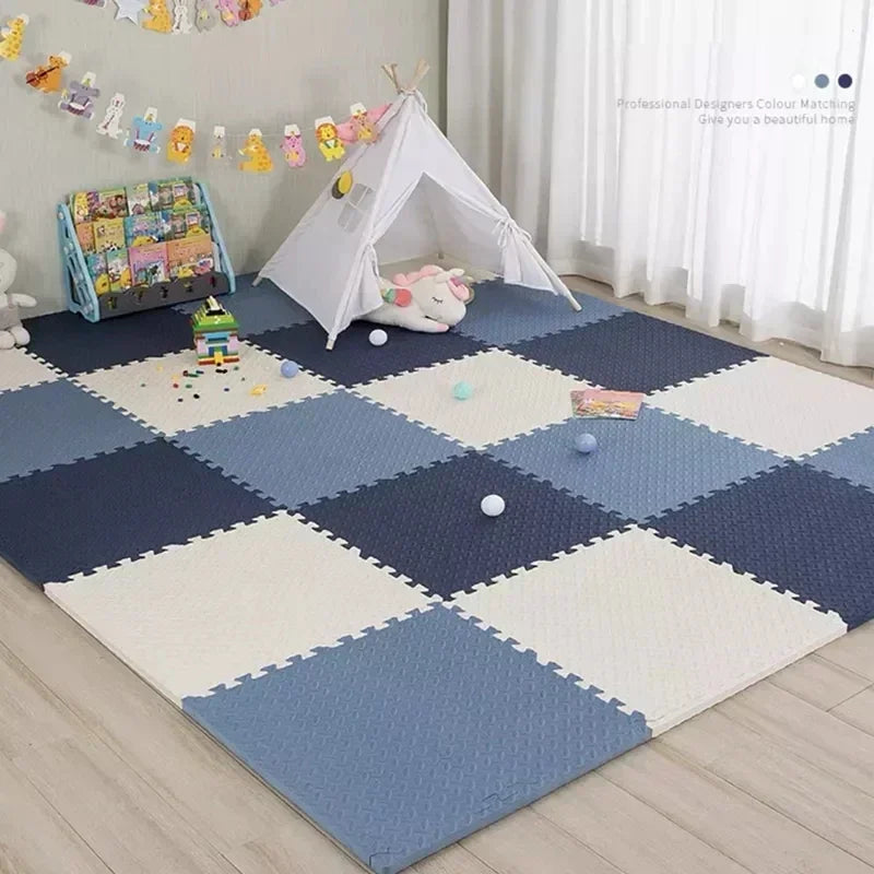 Children's playroom with a blue and white foam puzzle mat, toy chest, and teepee.