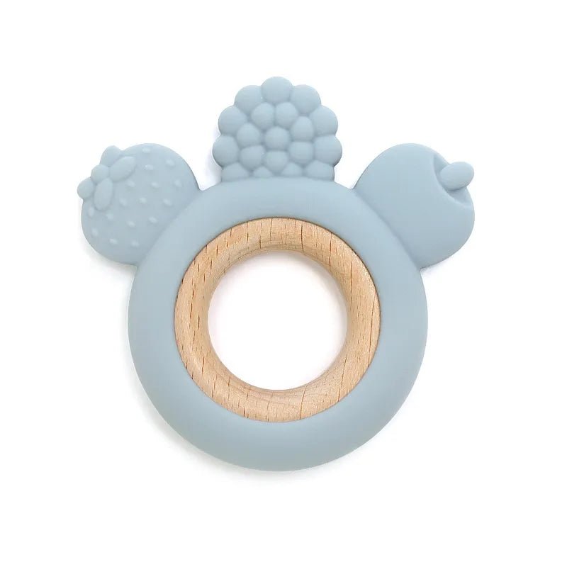 Blue teething ring with wooden center on a white background