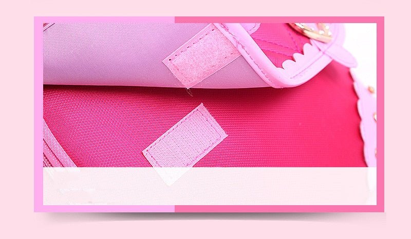 Close-up of a pink fabric with mesh and stitching details on a pink background