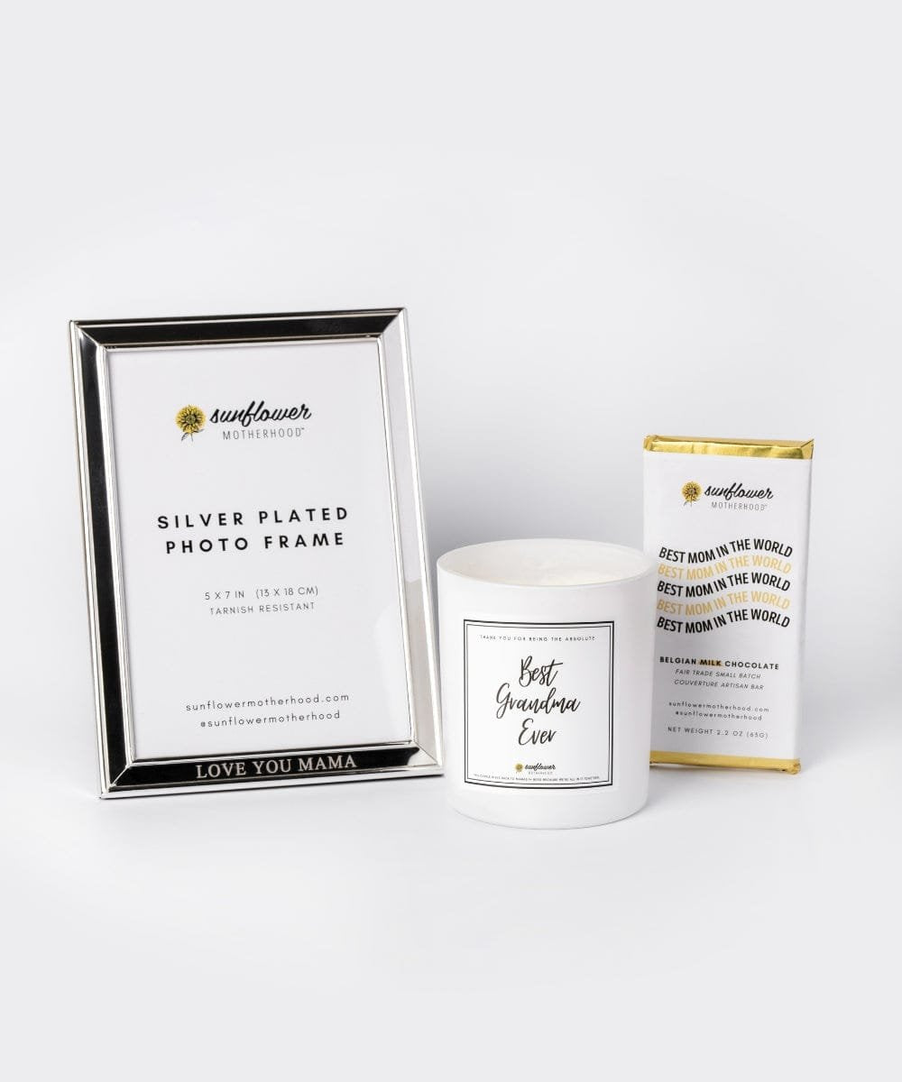 Silver photo frame, candle, and chocolate bar.