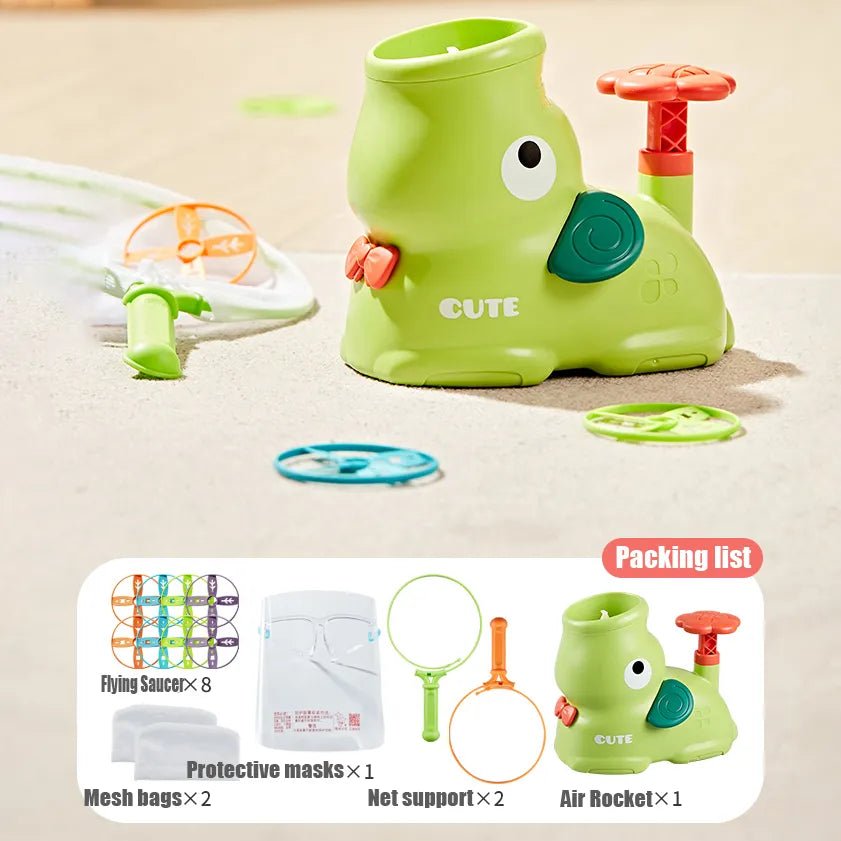 Green toy with cartoon face on a beige background, accompanied by a packing list of accessories.