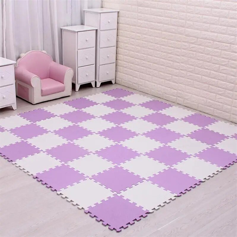 Checkered purple and white foam mat in a room with a pink chair and white dresser.