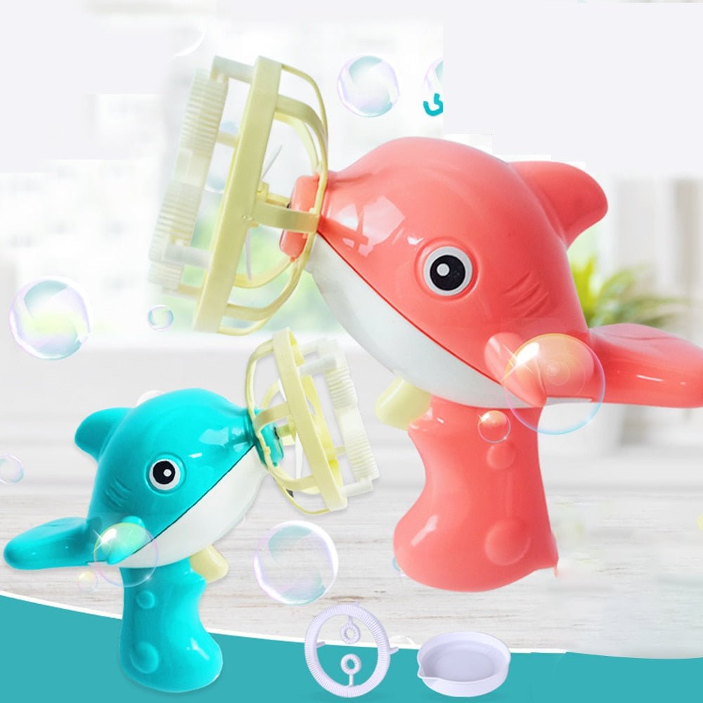 Two bubble-making toys shaped like dolphins, one pink and one blue, with bubbles around them.