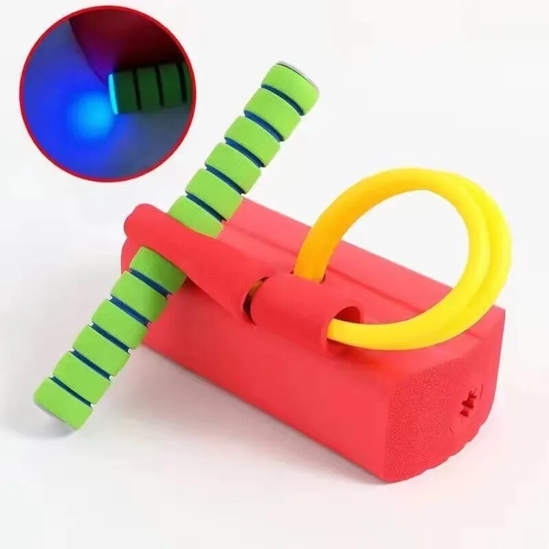 Colorful toy with a green handle and a yellow ring