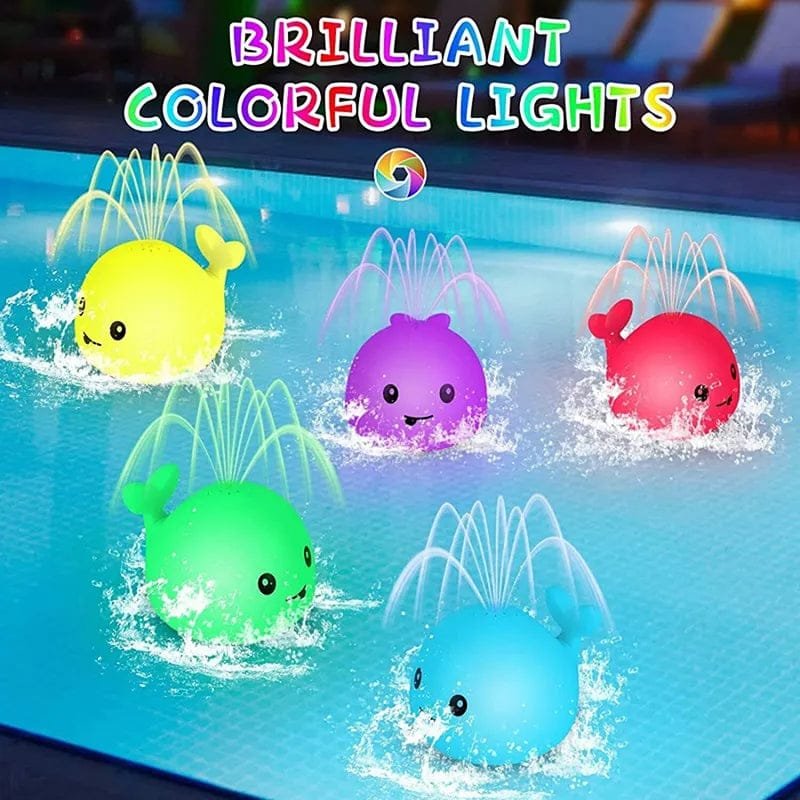 Five colorful whale-shaped water sprayer toys in a pool with 'BRILLIANT COLORFUL LIGHTS' text above.