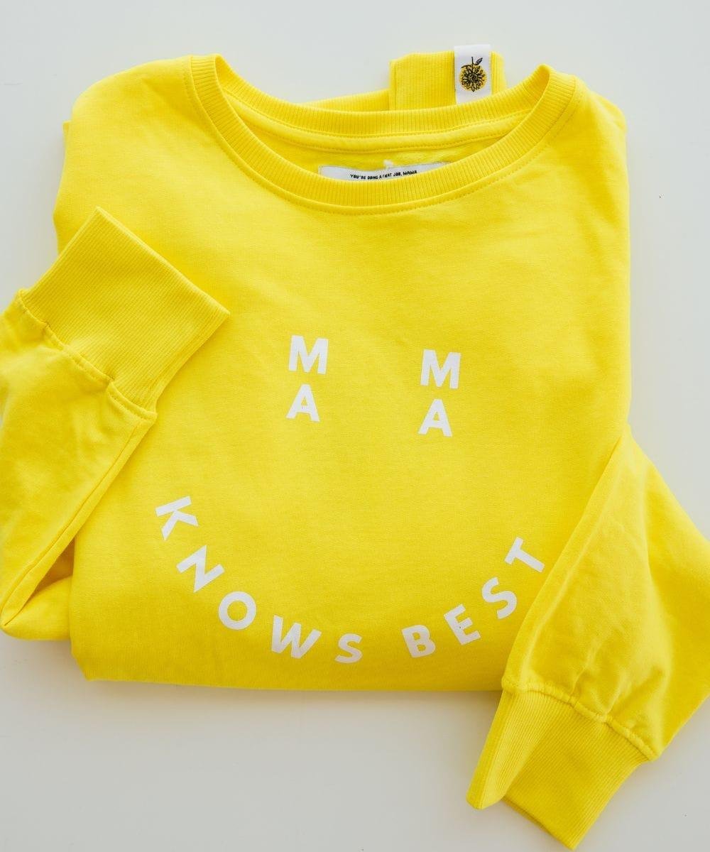 Yellow sweatshirt with 'MAMA KNOWS BEST' text on a light gray background