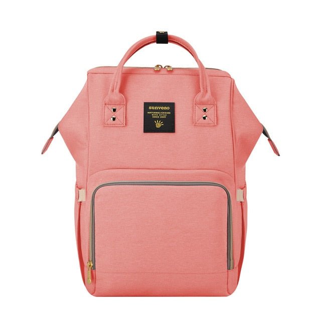 Pink backpack with a visible brand logo.