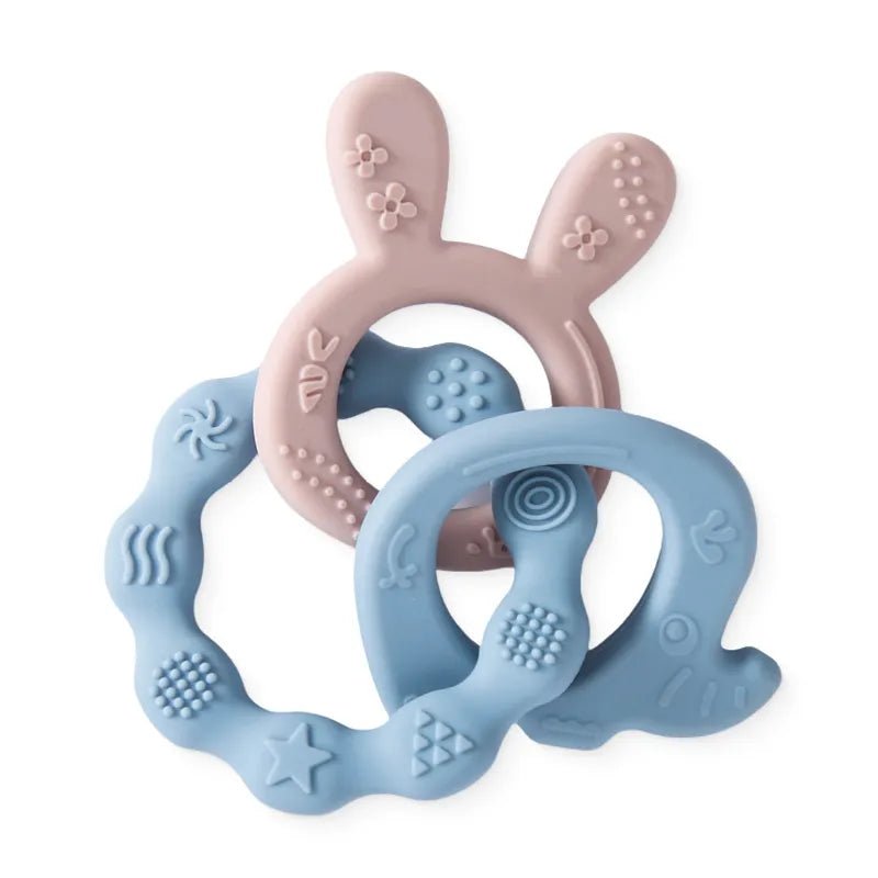 Two silicone teething rings, one pink and two blue.