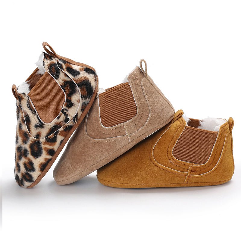 Three pairs of baby shoes with leopard print and brown suede
