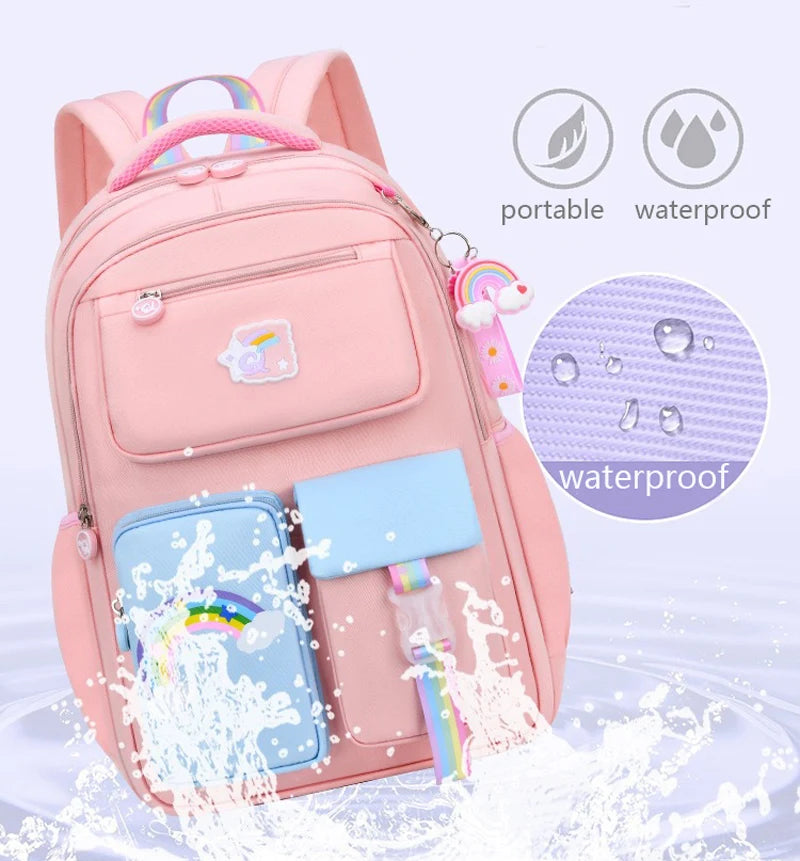 Pink backpack with unicorn design and accessories.