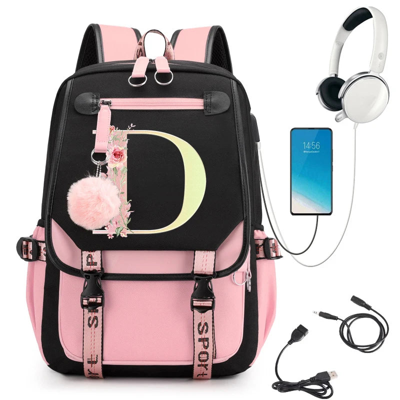 Pink and black backpack with floral 'D' design, smartphone, headphones, and USB cable.