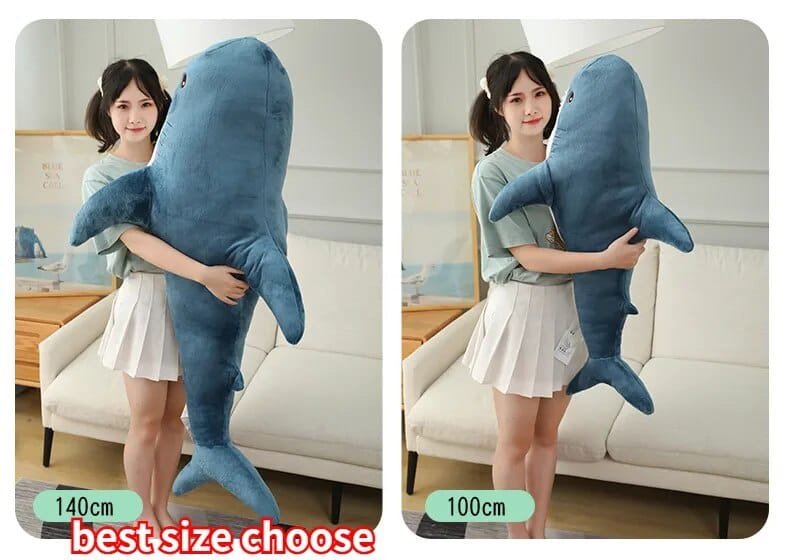 Two images of a person holding a large blue shark plush toy, with size labels indicating 140cm and 100cm.