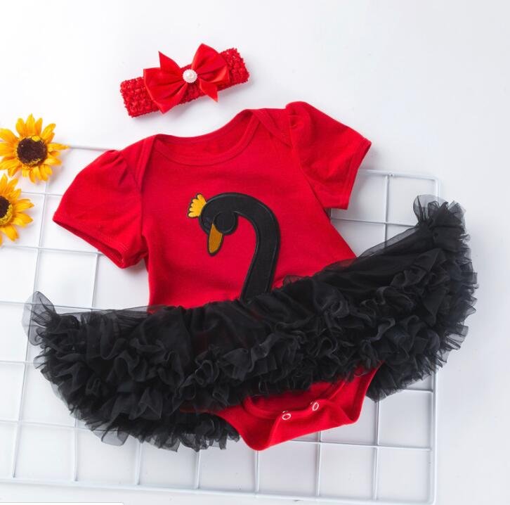 Red baby outfit with black tutu and yellow flower, accompanied by a red headband with a bow.