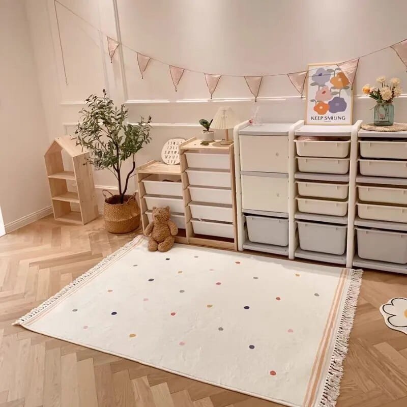 Children's room with colorful rug, storage units, and decorative elements.
