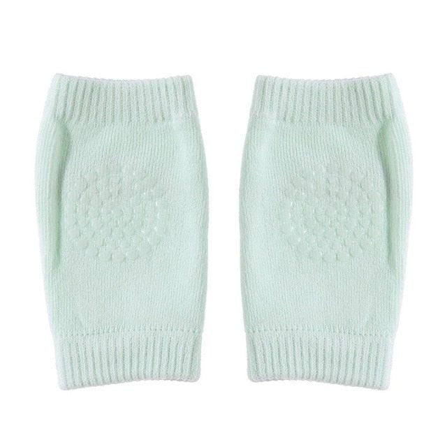 Pair of light green knitted leg warmers