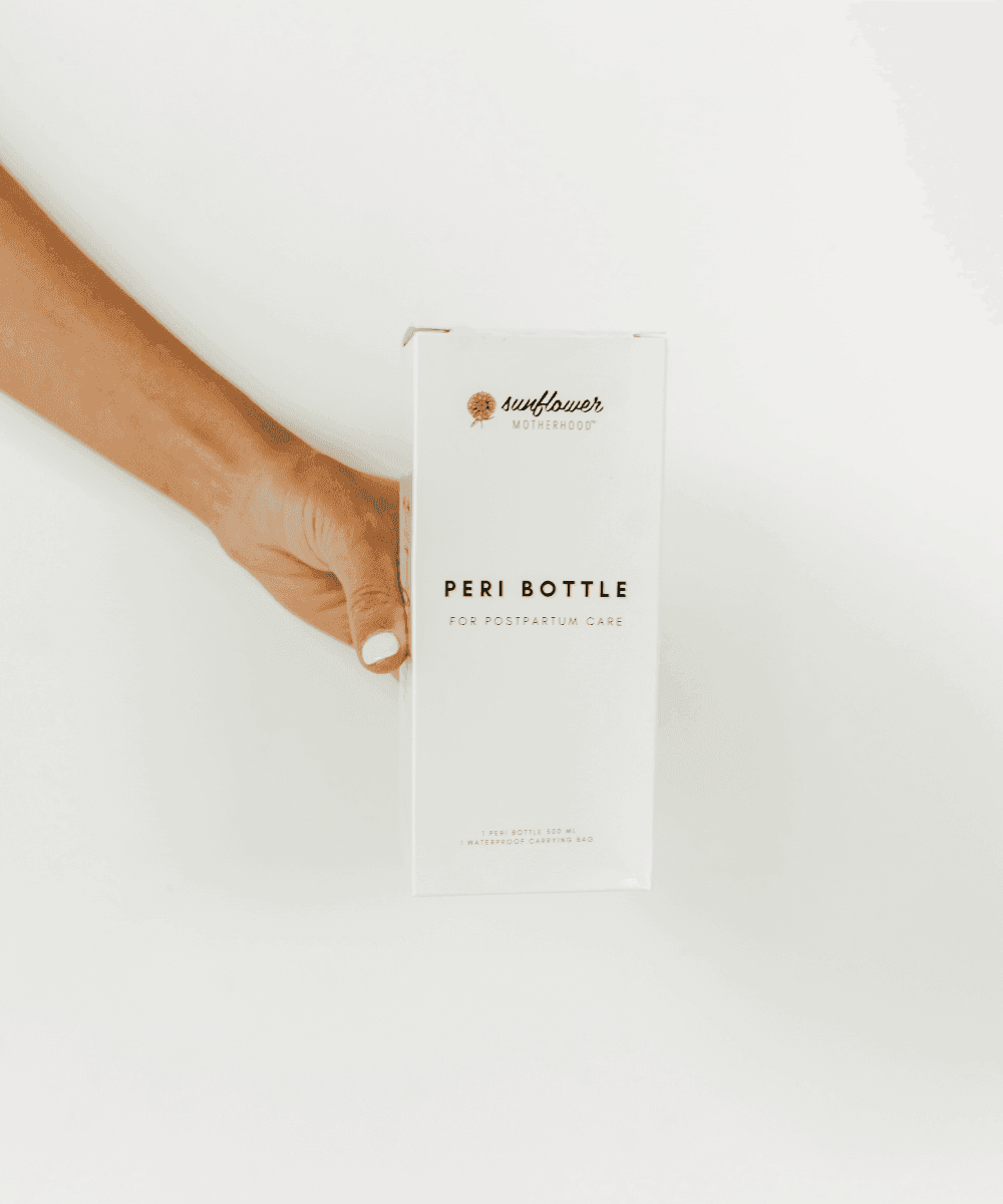 Hand holding a box labeled 'Peri Bottle'