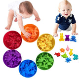 Colorful baby toys including soft balls and animal shapes on a white background.