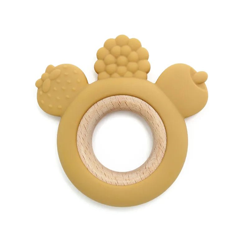 Yellow teething ring with wooden center on a white background