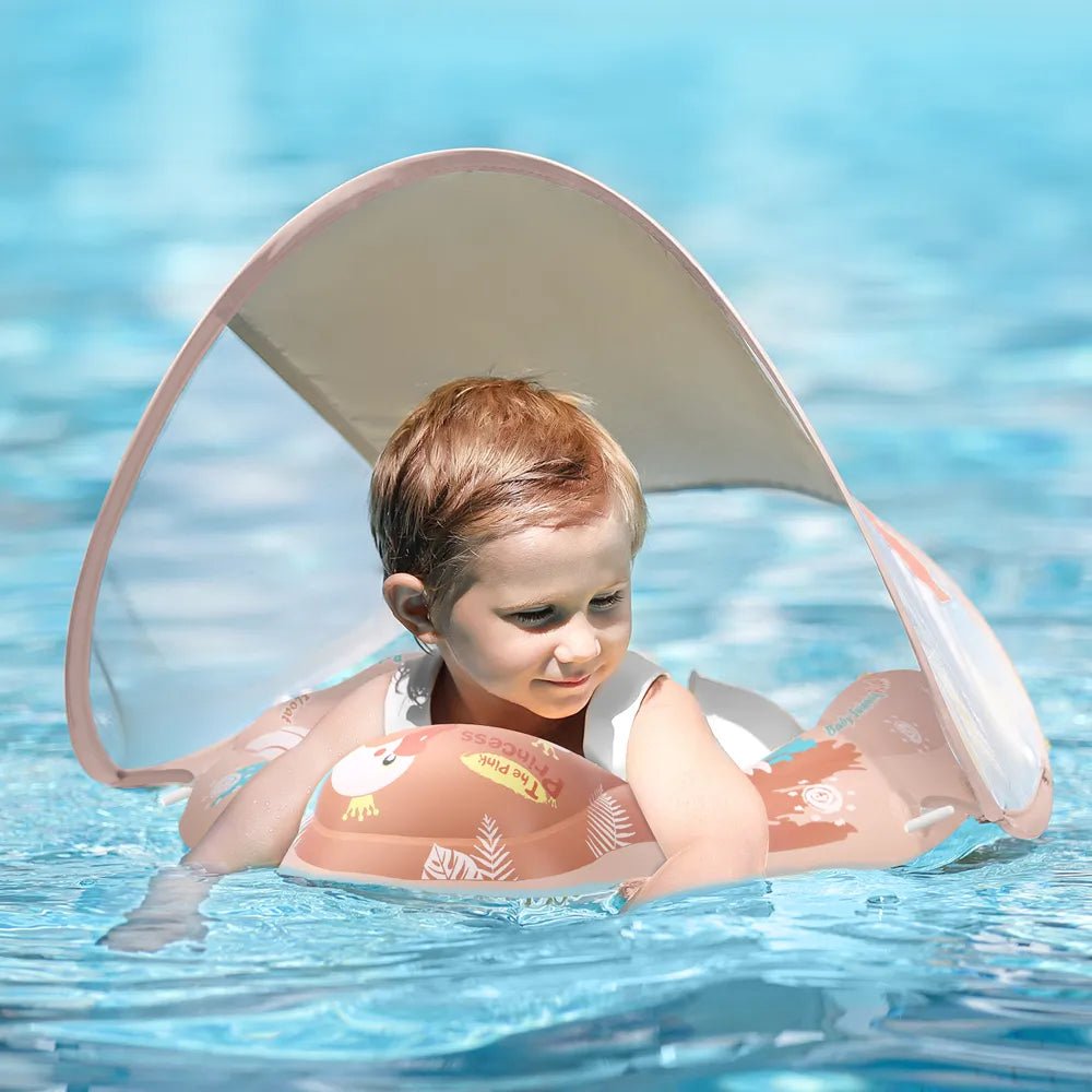 Child in a pool with a pink inflatable shark float and canopy