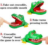 Green crocodile toy with open mouth, showing how to play the game.