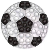 Circular pop-it fidget toy with alternating black and white bubbles on a white background
