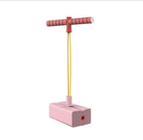 Pink pogo jump with red handle on a white background