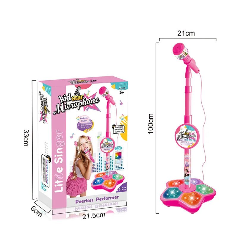 Pink toy microphone with stand and packaging on a white background