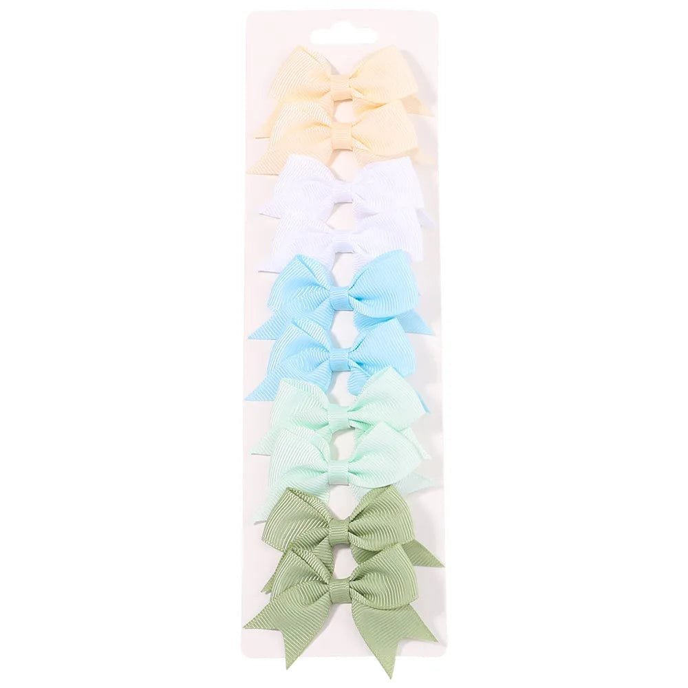 Set of colorful hair bows on a white background