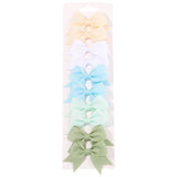 Set of colorful hair bows on a white background