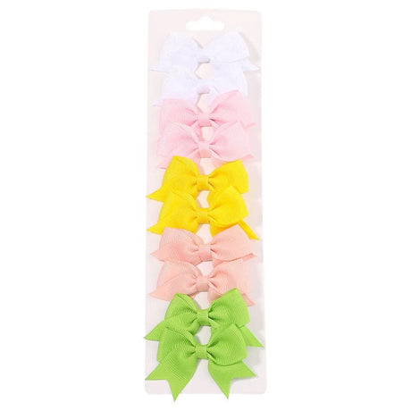 Set of colorful hair bows in a clear packaging