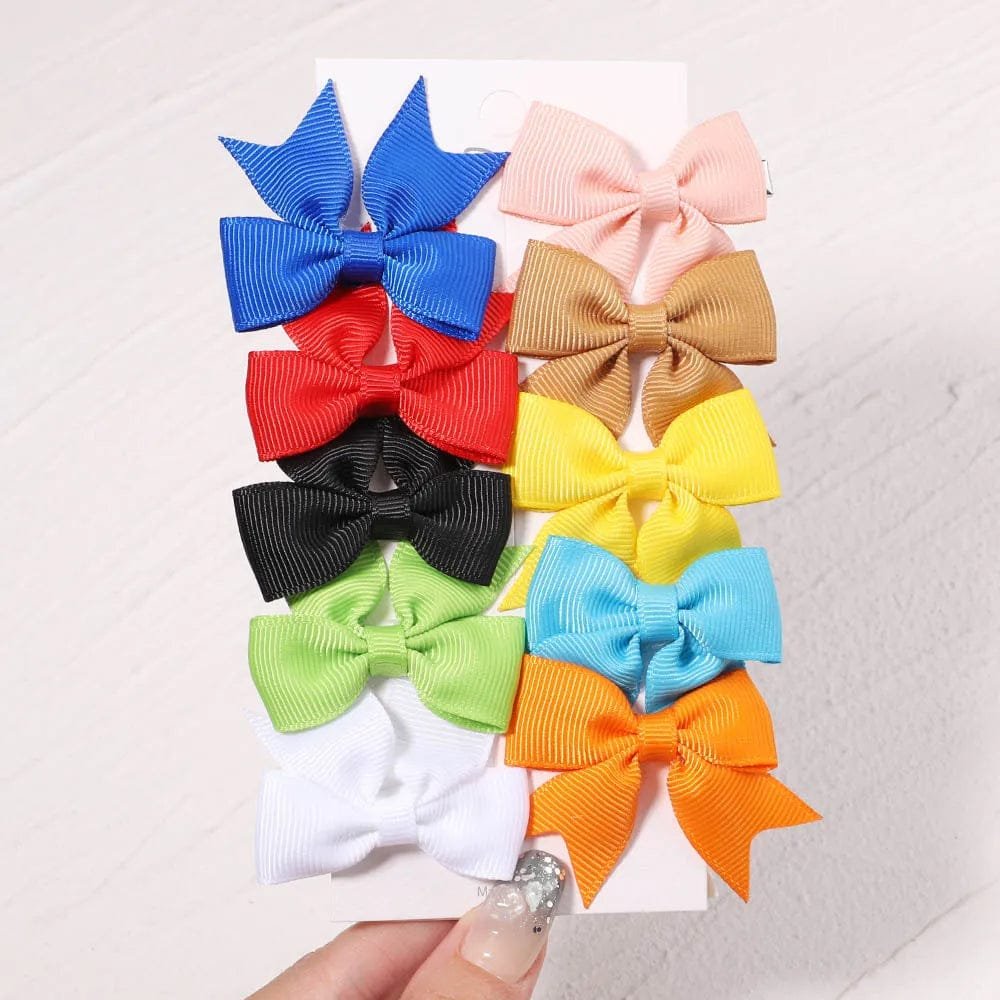 Assorted colorful hair bows on a white background