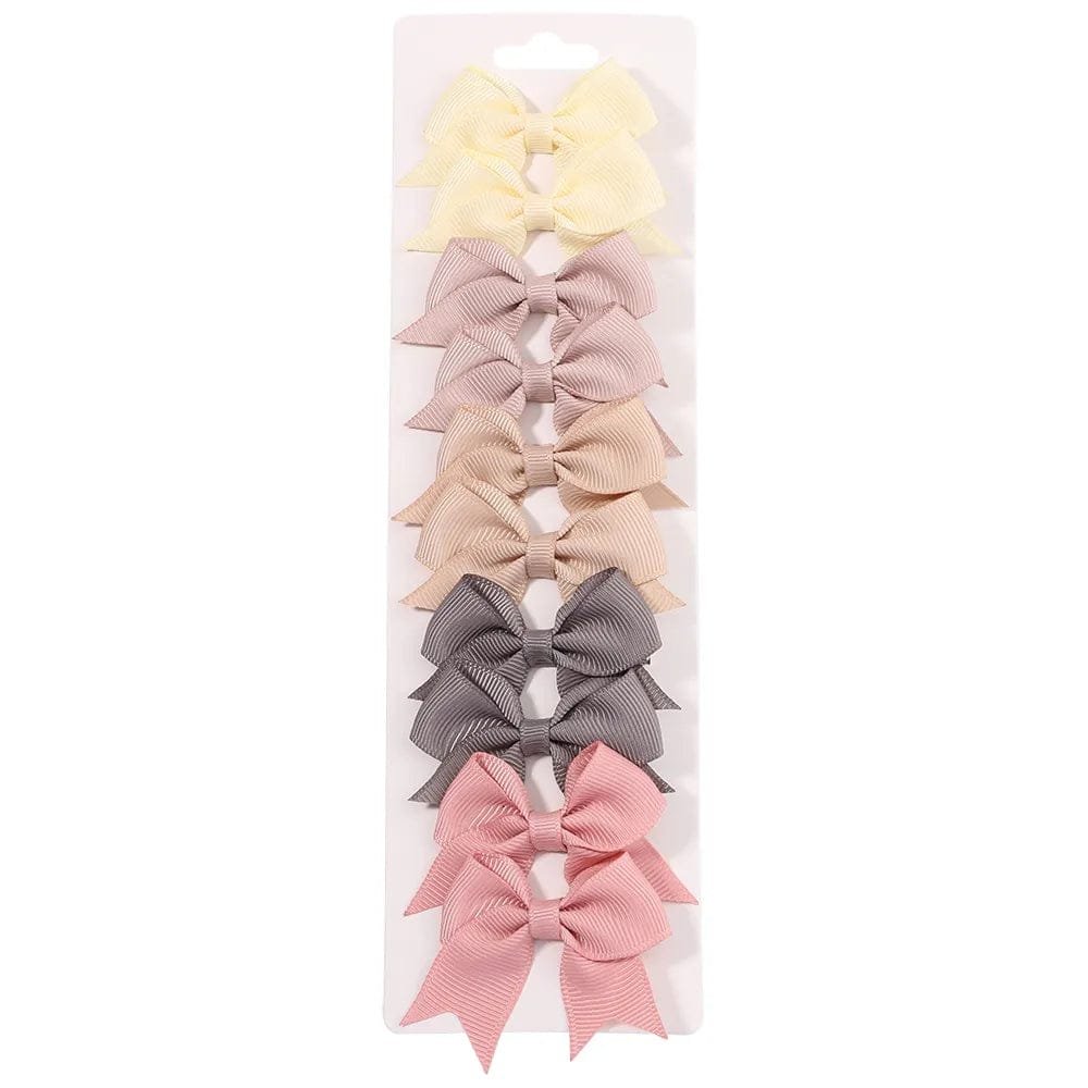 Set of colorful hair bows on a white background