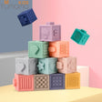 Colorful baby blocks with textures and shapes on a pastel background, featuring the Tomama Kids brand.