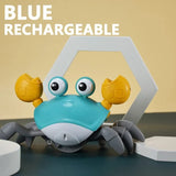 Blue rechargeable toy crab with a yellow shell on a beige background