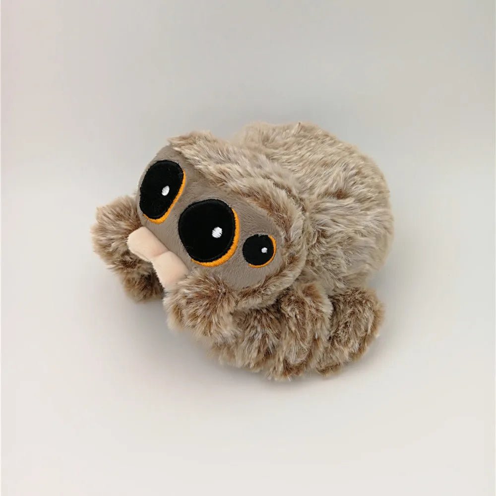 Plush toy sloth with large eyes on a white background
