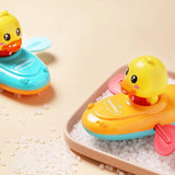Two colorful rubber duck bath toys on a beige background