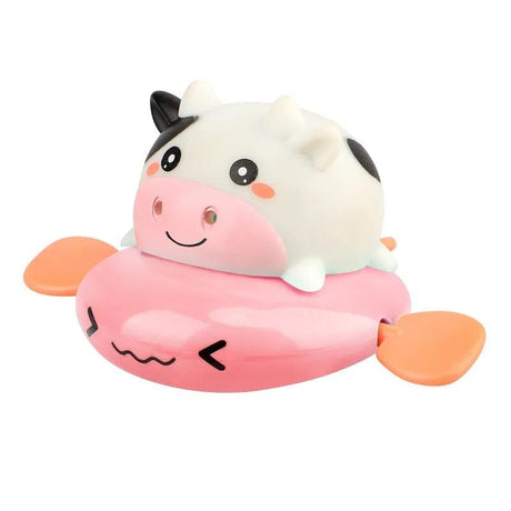 Cute cartoon cow toy with a pink floaty on a white background